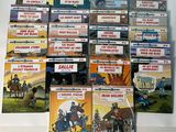 a lot of books that are on the table