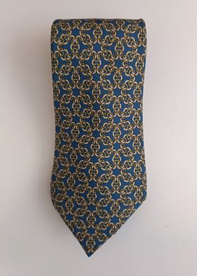 a close up of a tie hanging on a wall