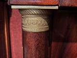 a close up of a wooden table with a metal handle on it