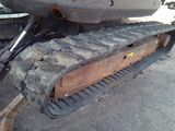 an image of a close up of a tractor tracks