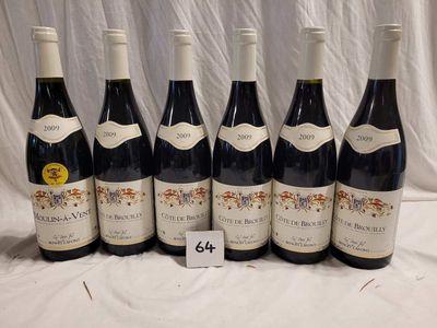 six bottles of red wine are lined up on a table