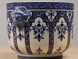 a blue and white bowl with a ram head on it