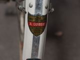 a close up of a bicycle with a badge on it