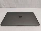 an apple macbook air laptop computer sitting on a white surface