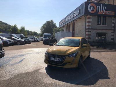 cars are parked in a parking lot in front of a building