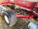 an image of a tractor that is parked in the grass