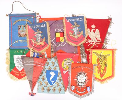 many different colored flags hanging on a wall