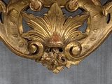 a marble table with a gold leaf decoration on top of it