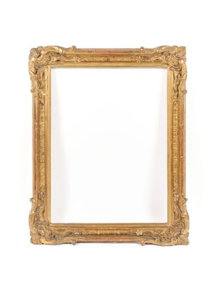 a gold frame with a white background and a white wall