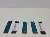 three different types of memory cards sitting on top of a table