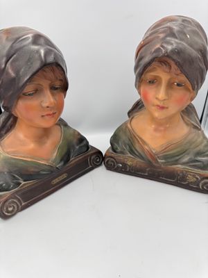 pair of ceramic figurines of a woman and a child
