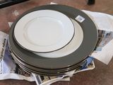 several plates stacked on top of each other on top of newspapers