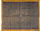 an old silk rug with a medallion on it