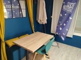 a small table and chairs in the corner of a room