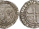 a silver coin with a cross on the front and a shield on the back