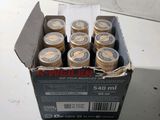 a box of six jars of beer sitting on a table