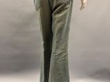 mannequin of a woman wearing green pants and a brown top
