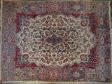 an oriental rug with a medallion design on a blue ground
