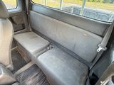 a seat in the back of a car that has been vandalized