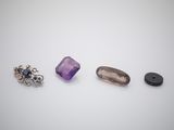 three different types of gems are shown on a white surface
