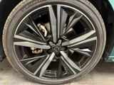 a close up of a tire on a blue car