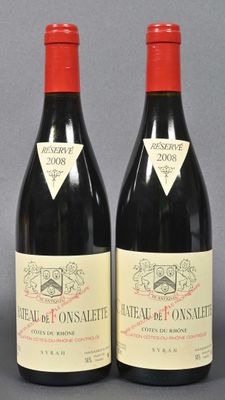 two bottles of red wine sitting next to each other on a table