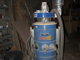a blue machine that is sitting in a room