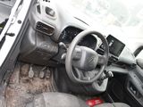 a car dashboard with a steering wheel and dashboard buttons