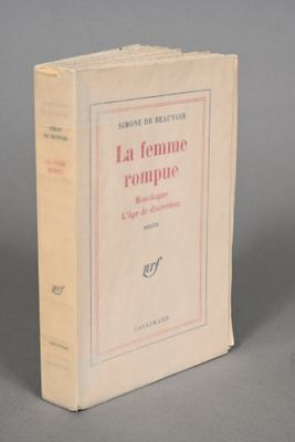 the book is sitting on a table with a gray background