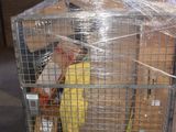 a large cage with a bunch of items in it