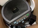 a box with a coffee cup and a coffee pot inside of it