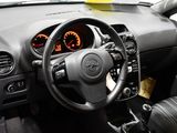 dashboard of a car with a steering wheel and dashboard gauges