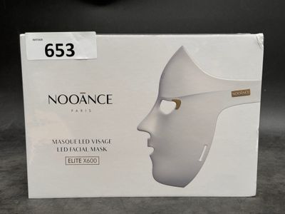 a white box with a white face mask on it
