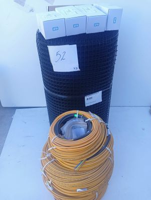 an image of a coil of yellow wires next to a trash can