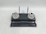 pair of antique silver plated candlesticks on black stand