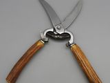 a close up of a pair of scissors on a table