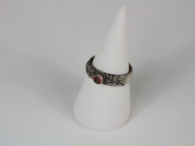a close up of a white cone with a ring on it