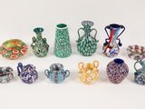 a lot of vases that are sitting on a table