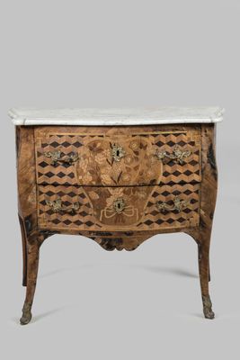 an antique chest of drawers with marble top