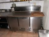 a stainless steel counter top in a commercial kitchen