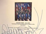 a signed poster with a picture of a group of people on it