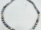 a black and white pearl necklace on a white background
