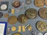 a lot of coins and other items on the table
