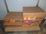 several boxes of food are stacked on a shelf in a room