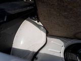 a toilet that is sitting in the middle of a pile of trash