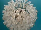 a glass ball hanging from the ceiling of a room