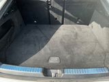 a trunk of a car with the back seats folded down