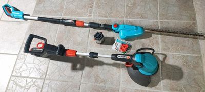 two tools that are sitting on a tile floor