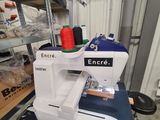 a sewing machine that is sitting on a table