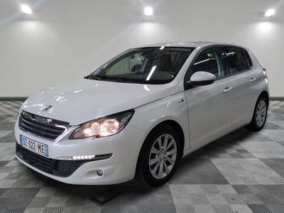 a picture of a white car that is parked in a garage